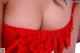 A close up of a woman wearing a red lingerie.