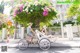 A man and a woman riding on the back of a rickshaw.